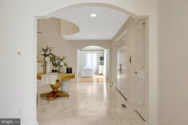 a living room with furniture a fireplace and a window