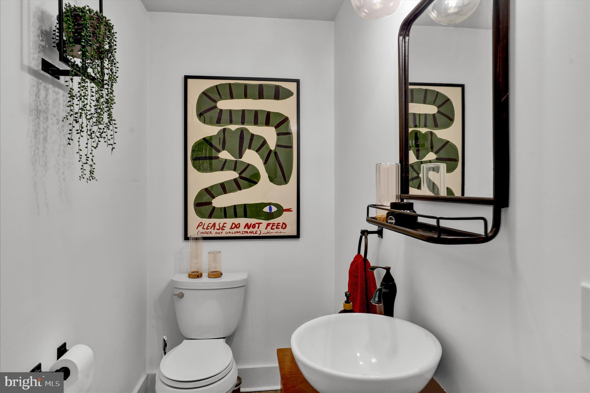 45 Mast Road Oley, PA 19547 - Photo 14 of 39 a bathroom with a toilet a sink and mirror