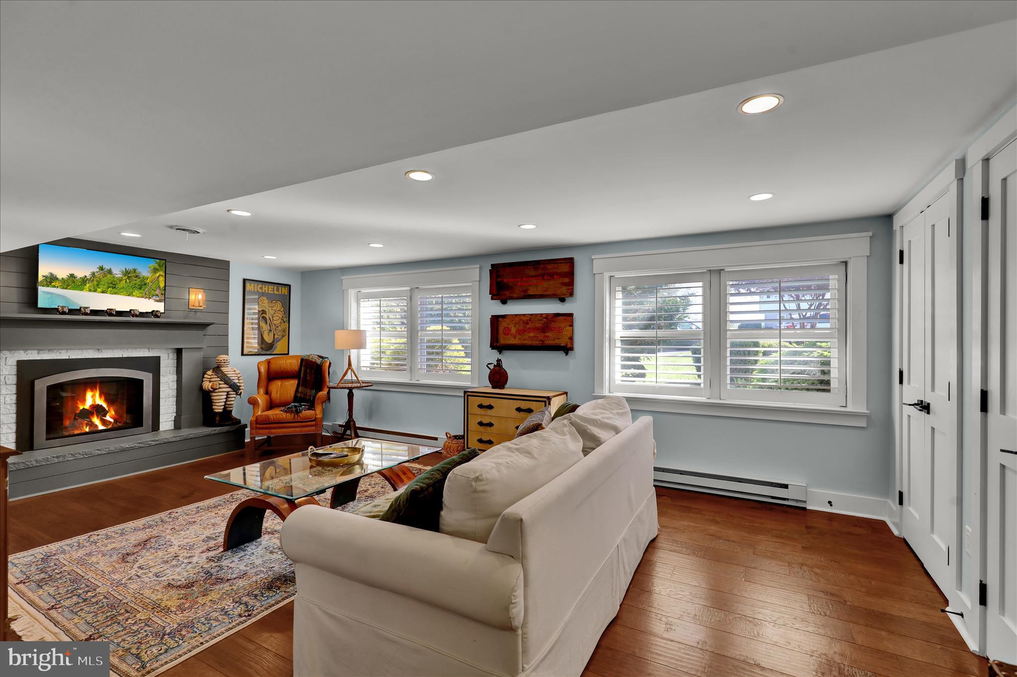45 Mast Road Oley, PA 19547 - Photo 24 of 39 a living room with furniture flat screen tv and a fireplace