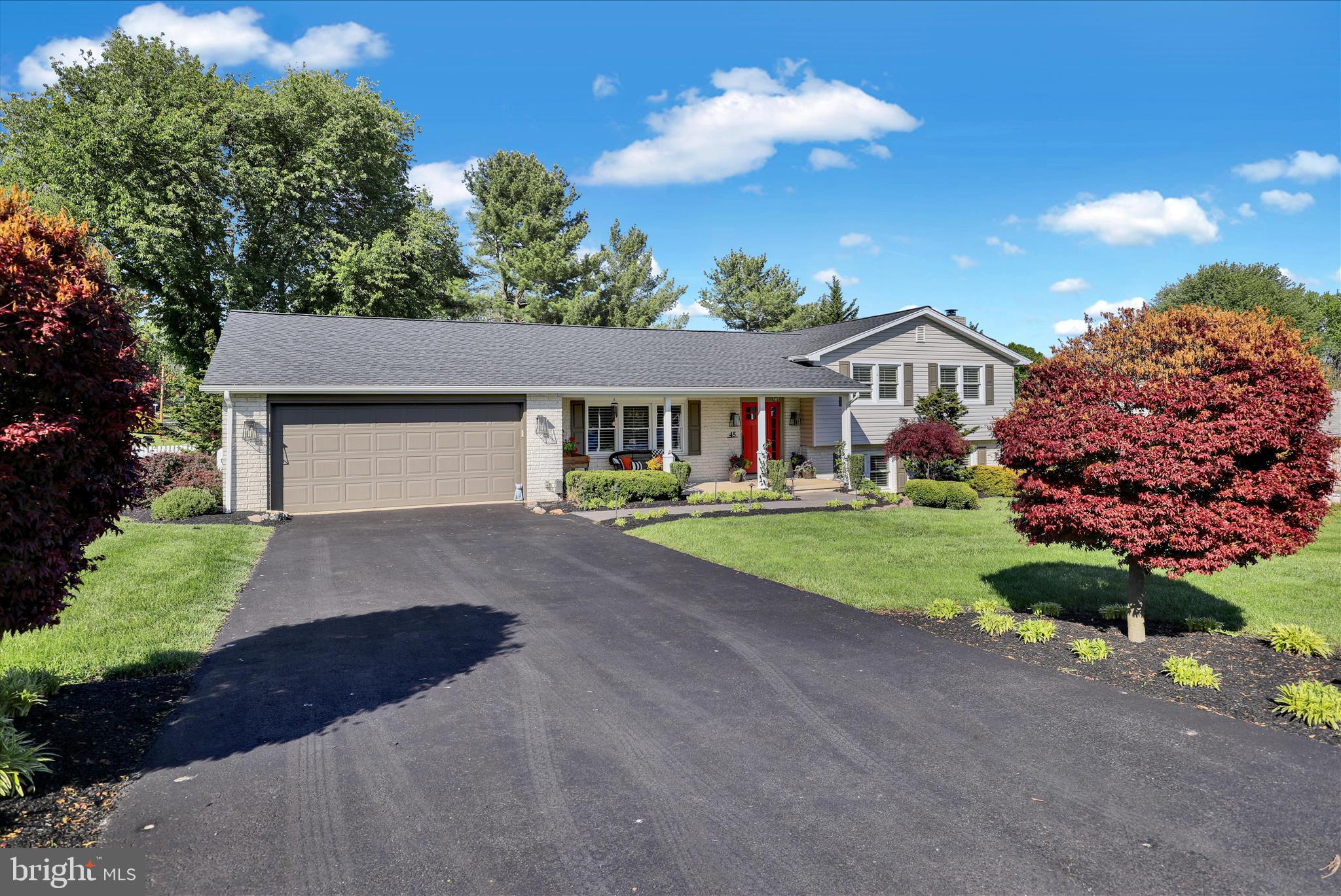 45 Mast Road Oley, PA 19547 - Photo 32 of 39 a front view of a house with a yard and garage