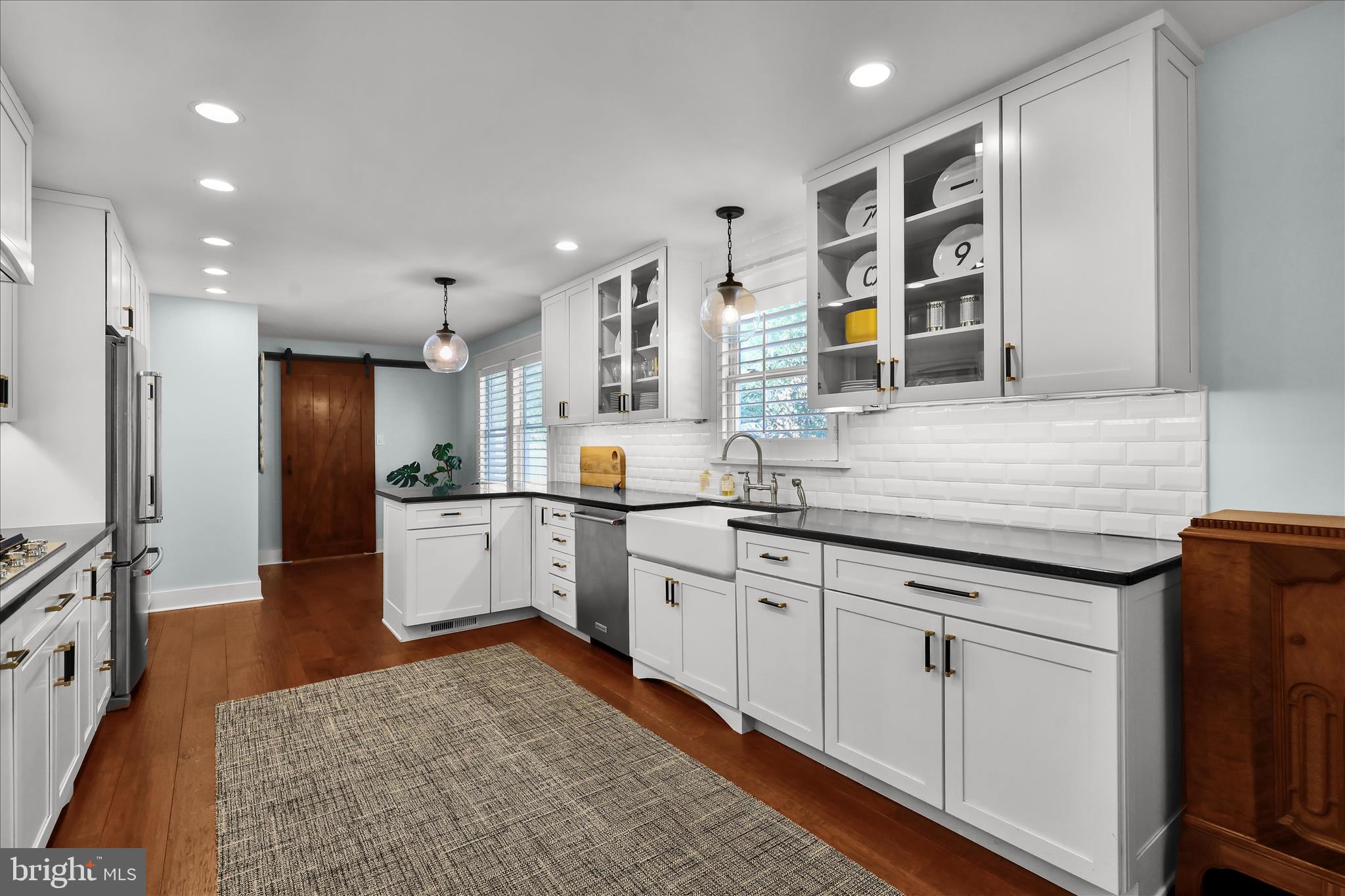 45 Mast Road Oley, PA 19547 - Photo 8 of 39 a kitchen with white cabinets and refrigerator