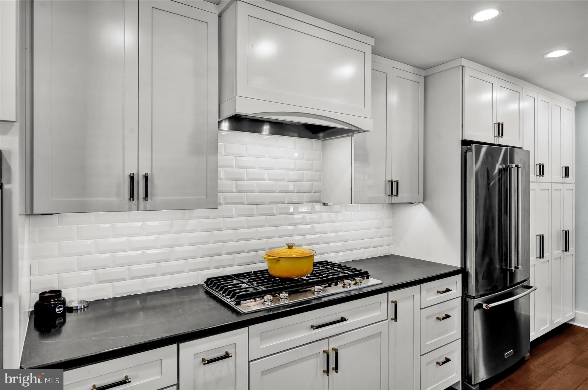 45 Mast Road Oley, PA 19547 - Photo 9 of 39 a kitchen with stainless steel appliances a refrigerator a sink and wooden cabinets