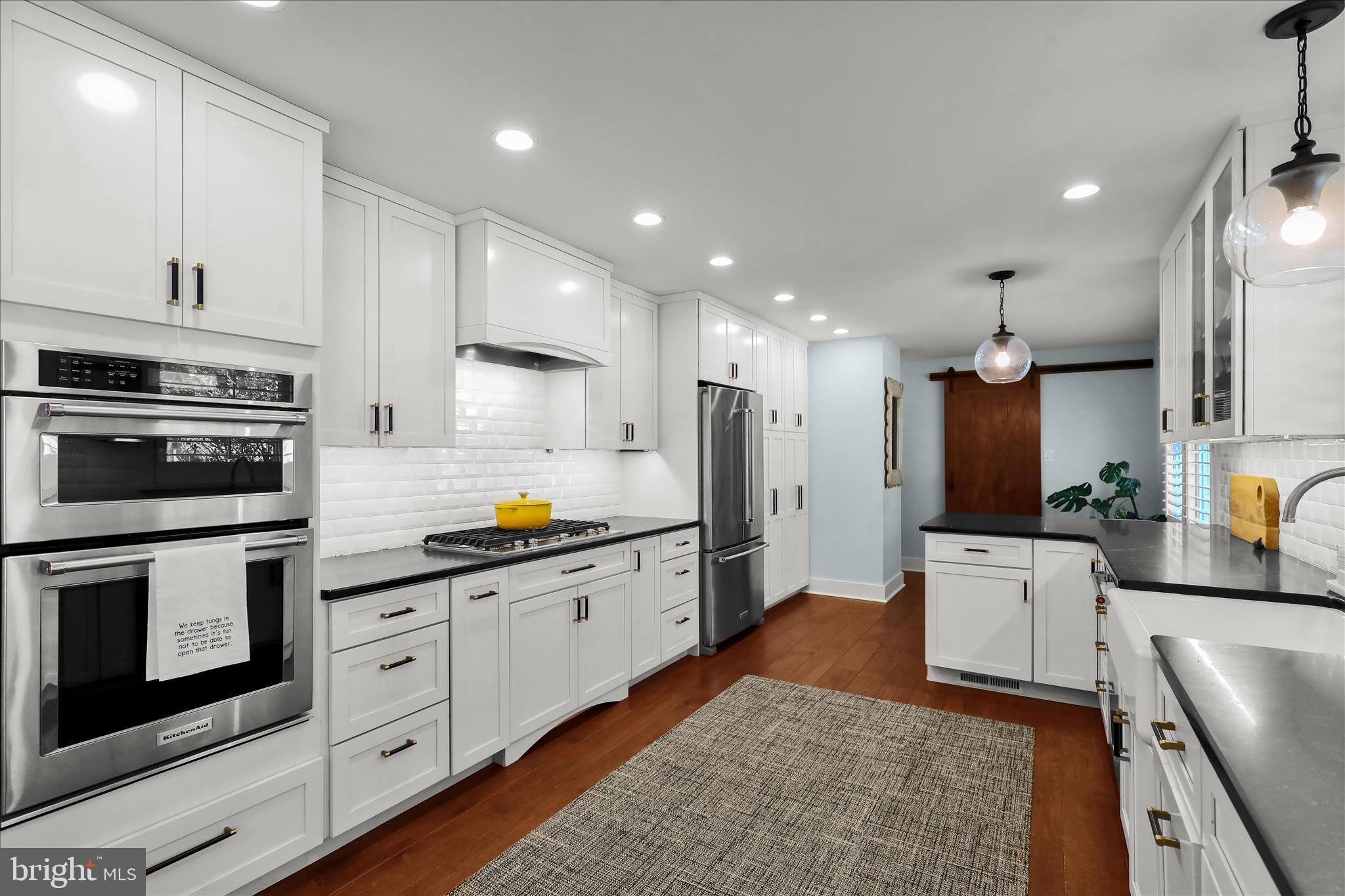 45 Mast Road Oley, PA 19547 - Photo 10 of 39 a large kitchen with stainless steel appliances granite countertop a stove a sink and a microwave