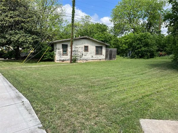 a backyard of a house with lots of green space