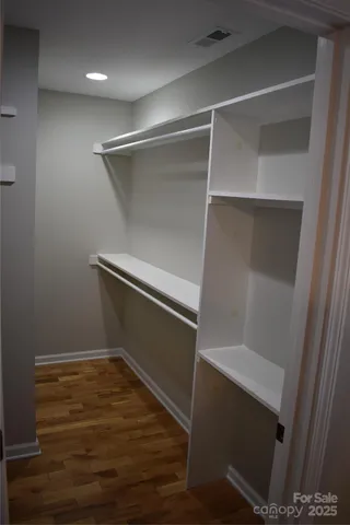 a kitchen with stainless steel appliances granite countertop a stove a refrigerator and a microwave