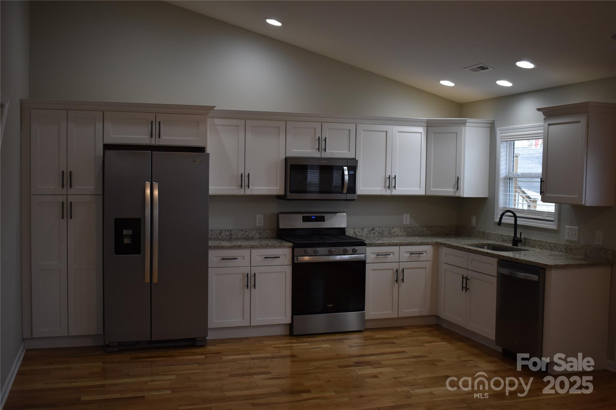 17 Meredith Lane Marion, NC 28752 - Photo 19 of 42 a kitchen with stainless steel appliances granite countertop a stove a refrigerator and a microwave
