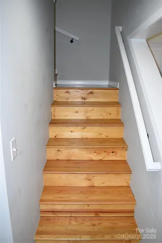 a kitchen with stainless steel appliances granite countertop a stove a sink dishwasher a refrigerator and a stove