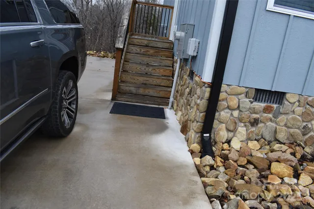 a view of water heater room with stairs
