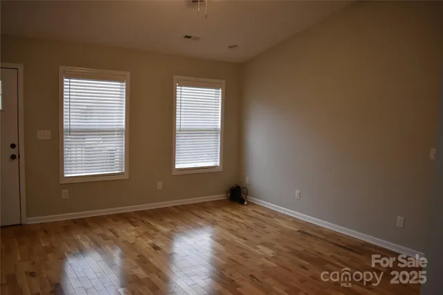 a bathroom with a granite countertop bathtub shower sink vanity and toilet