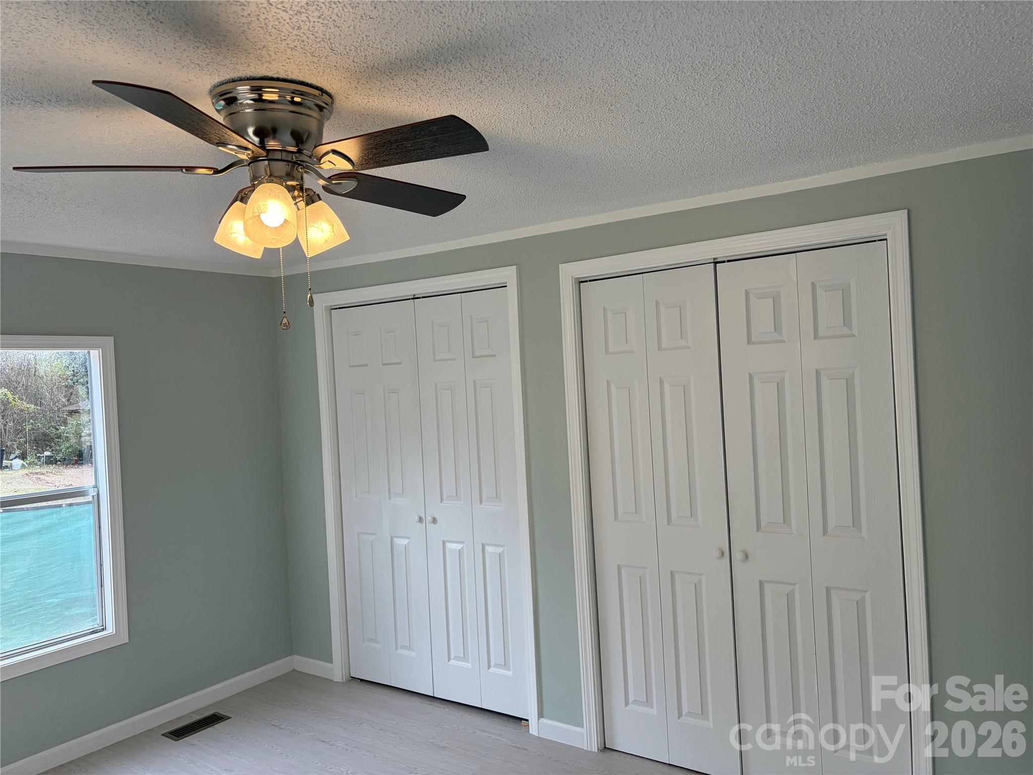590 Adams Road Morven, NC 28119 - Photo 14 of 15 a view of a chandelier fan and a window