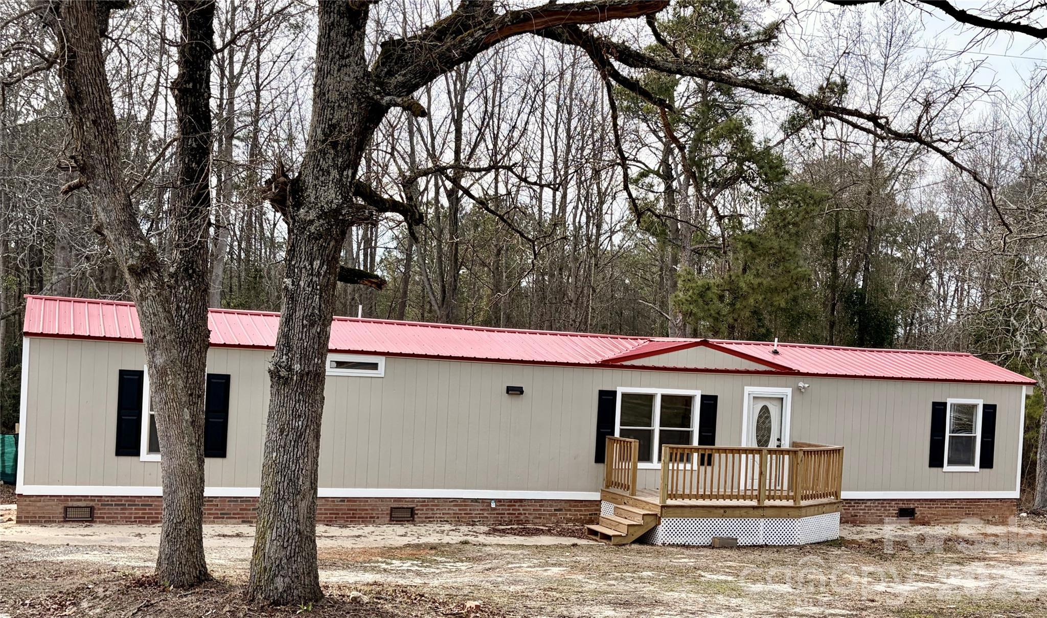 590 Adams Road Morven, NC 28119 - Photo 2 of 15 a front view of a house with a yard