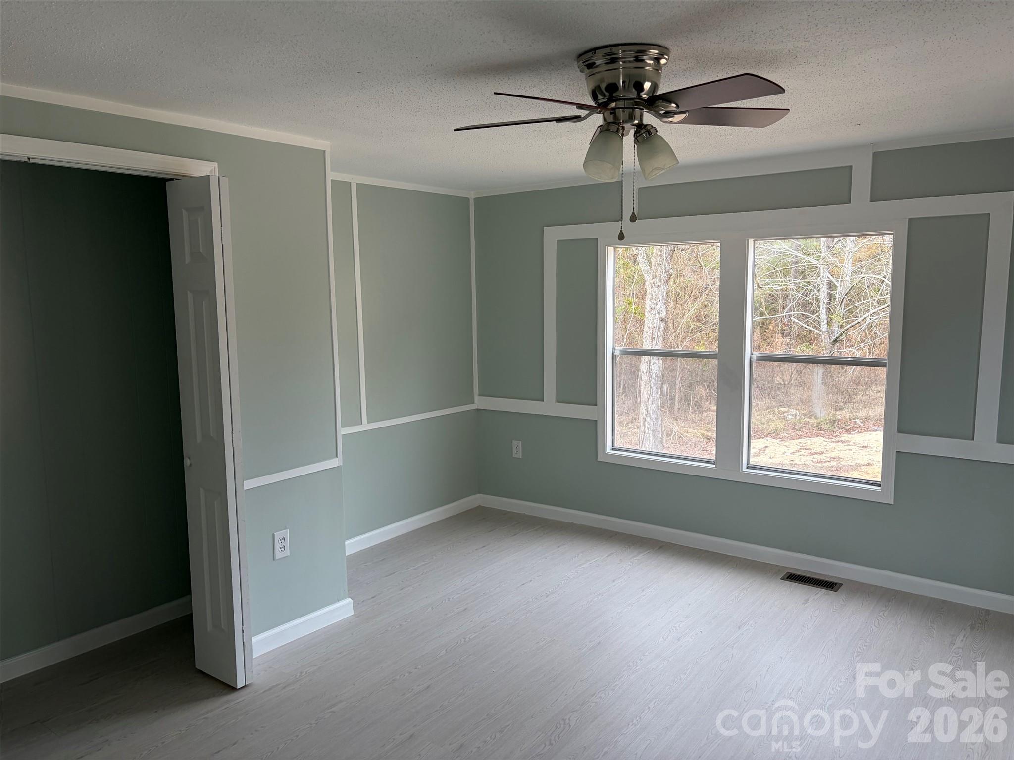 590 Adams Road Morven, NC 28119 - Photo 8 of 15 wooden floor in an empty room with a window