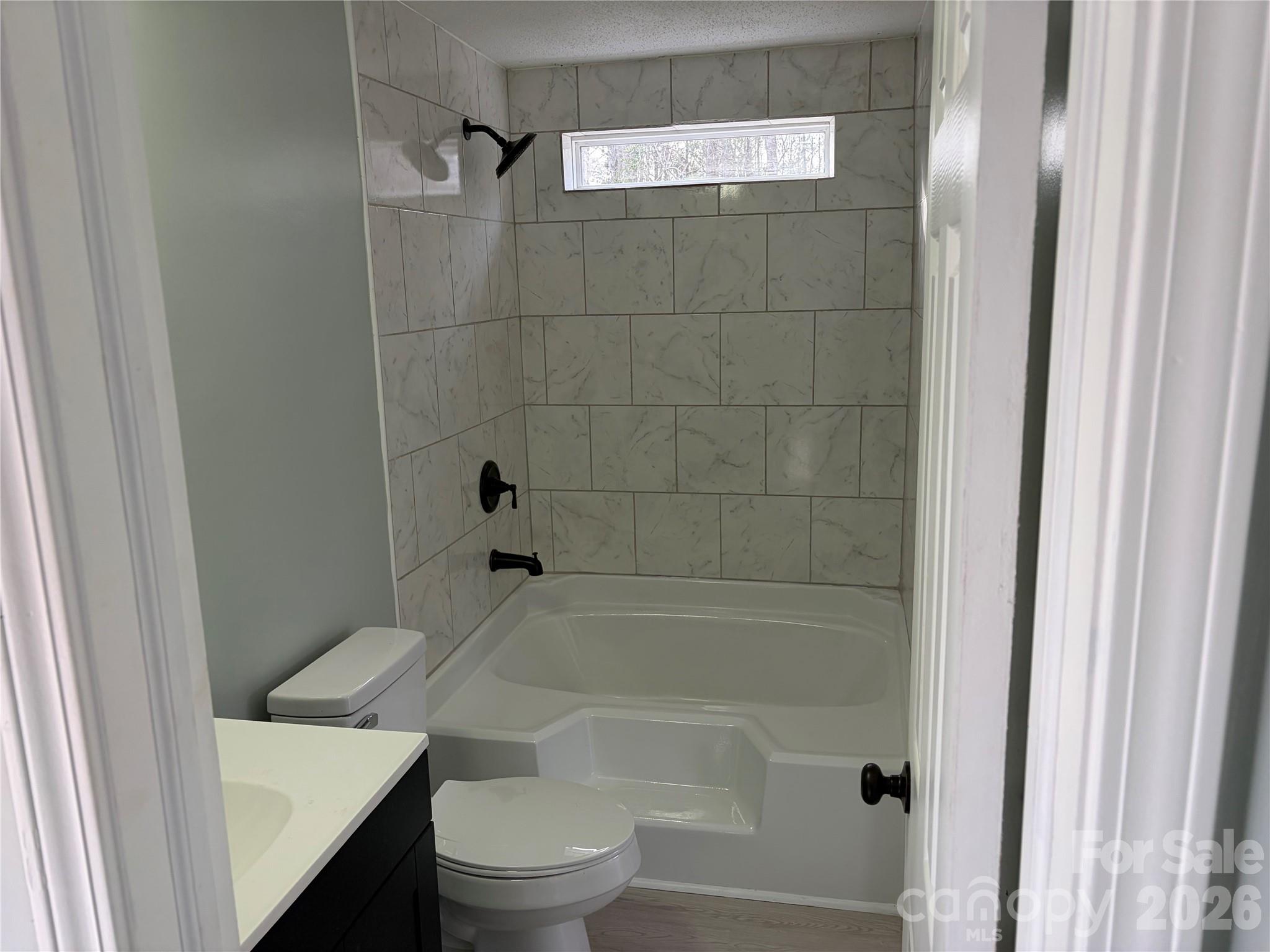 590 Adams Road Morven, NC 28119 - Photo 9 of 15 a bathroom with a bathtub and toilet