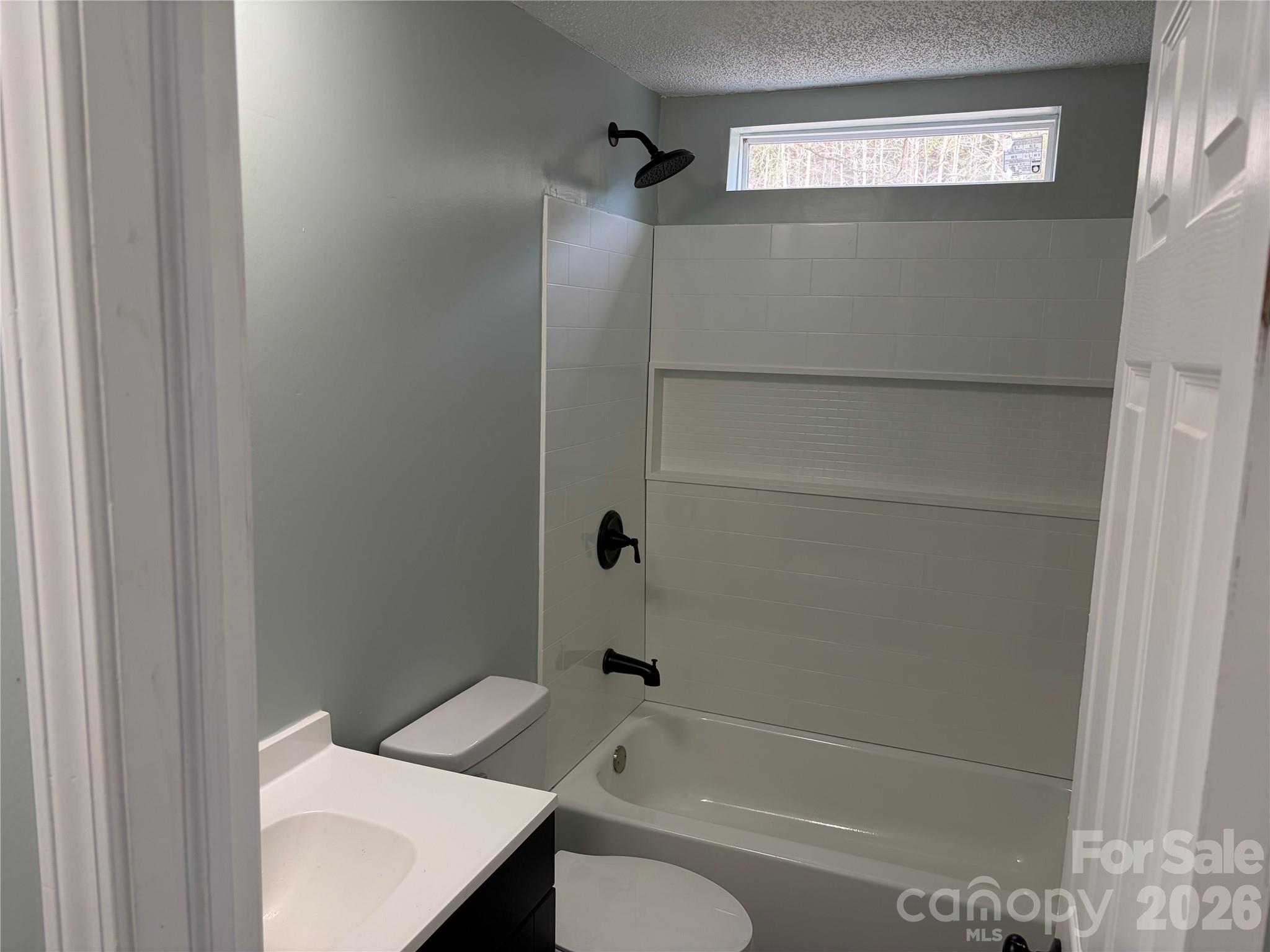 590 Adams Road Morven, NC 28119 - Photo 10 of 15 a bathroom with a bathtub and a shower