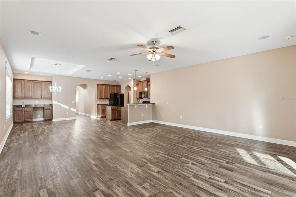 2506 West Ivy Street Tampa, FL 33607 - Photo 15 of 40 a view of a kitchen with wooden floor and a kitchen space with a sink