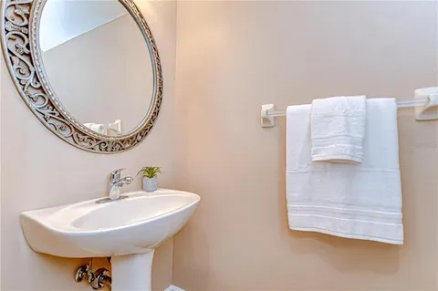 a bathroom with a sink a mirror and a toilet