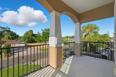 a view of a balcony with wooden floor