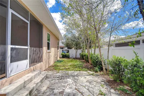 a view of a backyard with pathway