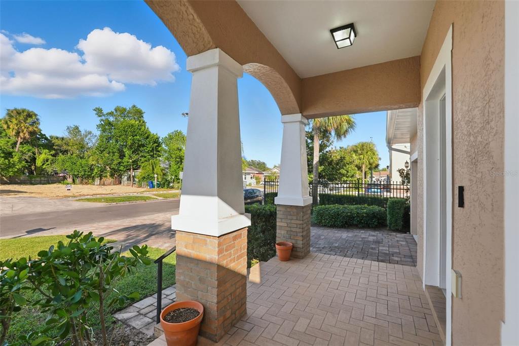 2506 West Ivy Street Tampa, FL 33607 - Photo 4 of 40 a front view of a house with garden and plants