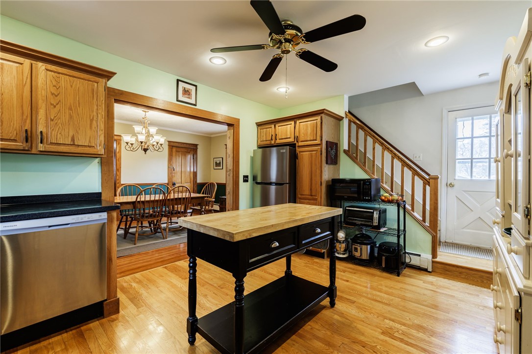 1116 Whitney Road East Perinton, NY 14450 - Photo 12 of 34 KITCHEN WITH SECOND STAIRCASE TO THE SECOND FLOOR