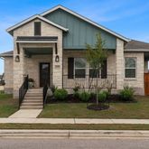 a front view of a house with garage