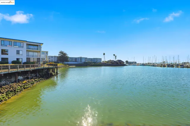 a swimming pool with outdoor seating and yard