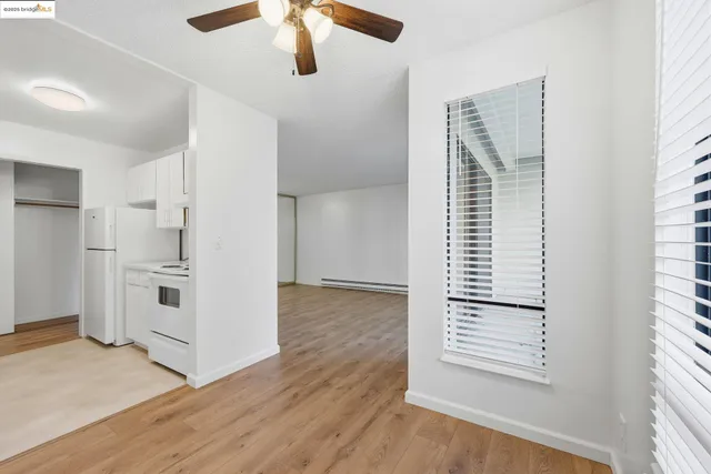 a view of kitchen with furniture and wooden floor