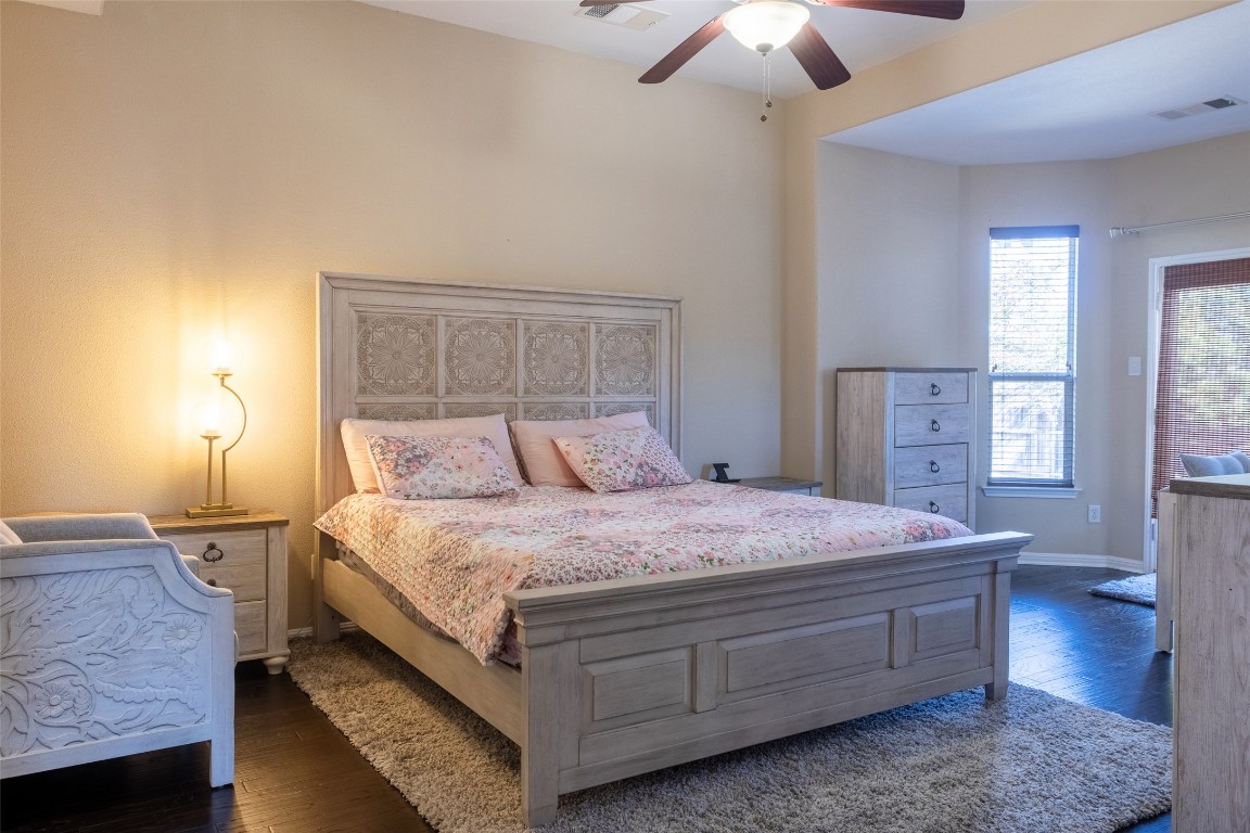 3113 Quail Run Round Rock, TX 78681 - Photo 19 of 29 Spacious Primary Bedroom with dark wood-style flooring and ceiling fan