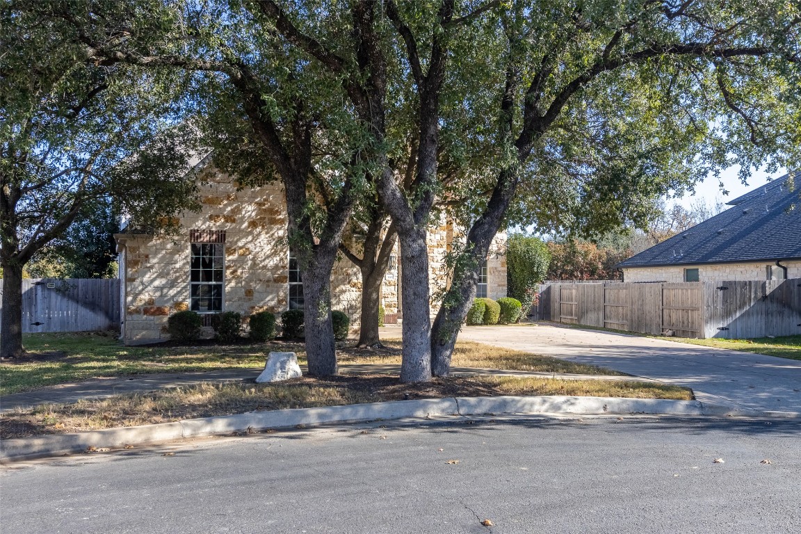 3113 Quail Run Round Rock, TX 78681 - Photo 2 of 29 Mature trees surround this home and there is a long driveway for extra parking