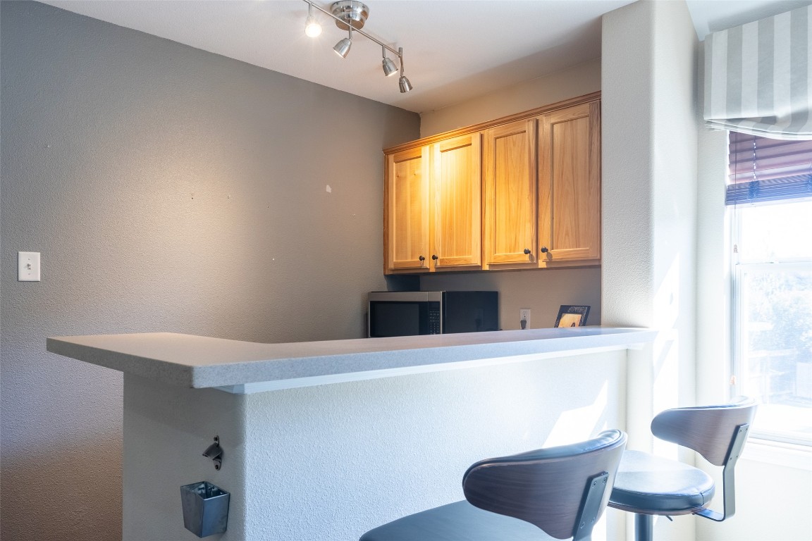 3113 Quail Run Round Rock, TX 78681 - Photo 29 of 29 Bar area upstairs featuring stainless steel microwave