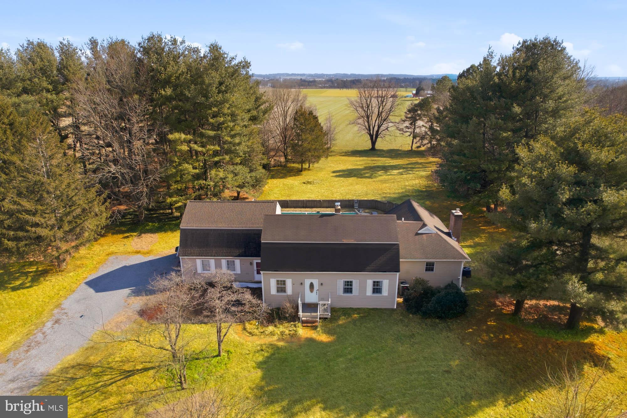 9543 Dublin Road Walkersville, MD 21793 - Photo 2 of 40 a view of a swimming pool with a patio