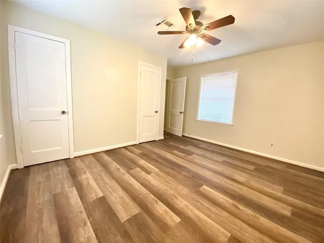 a view of a room with a wooden floor