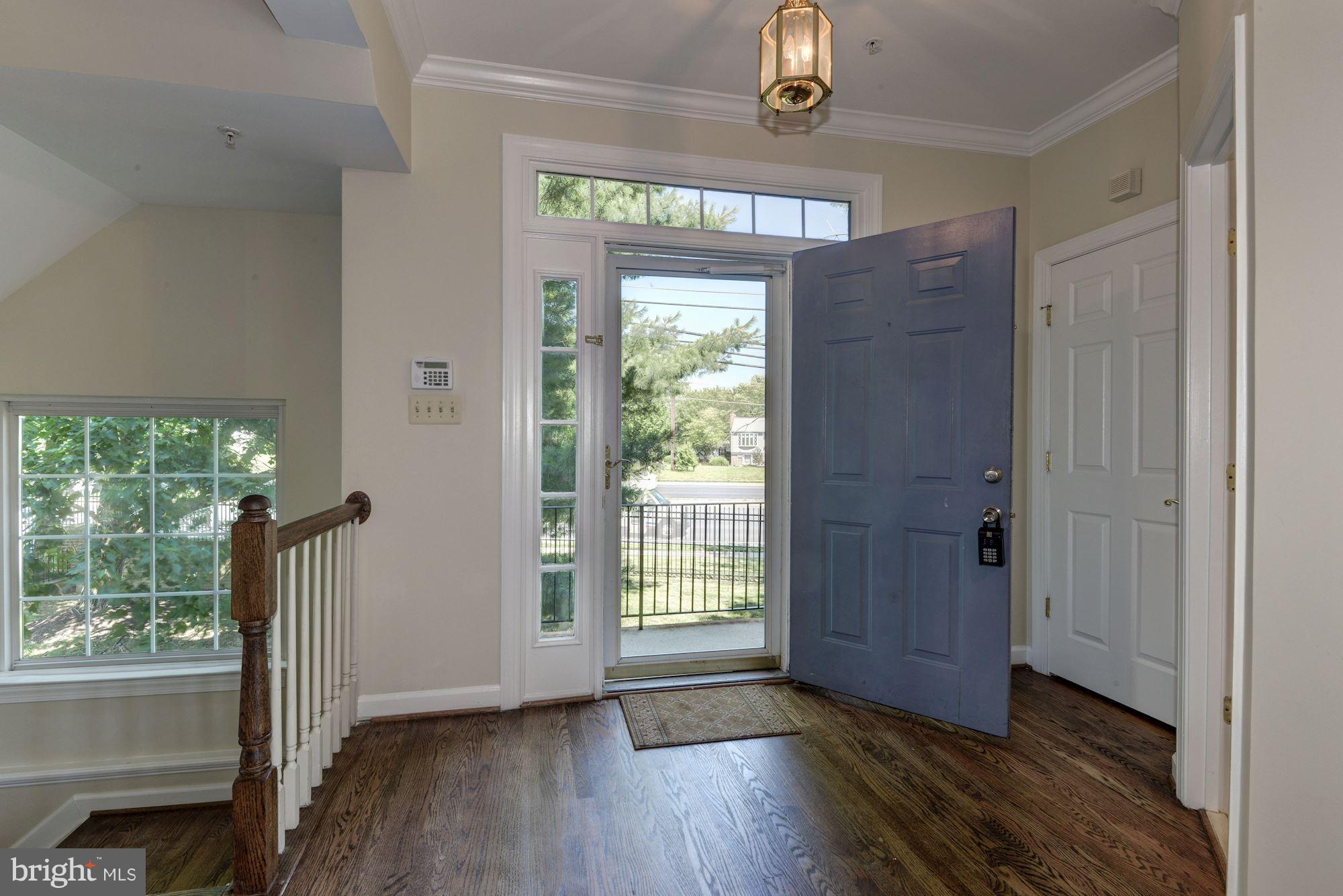 2101 Hounds Run Place Silver Spring, MD 20906 - Photo 2 of 30 a view of entryway with wooden floor and windows