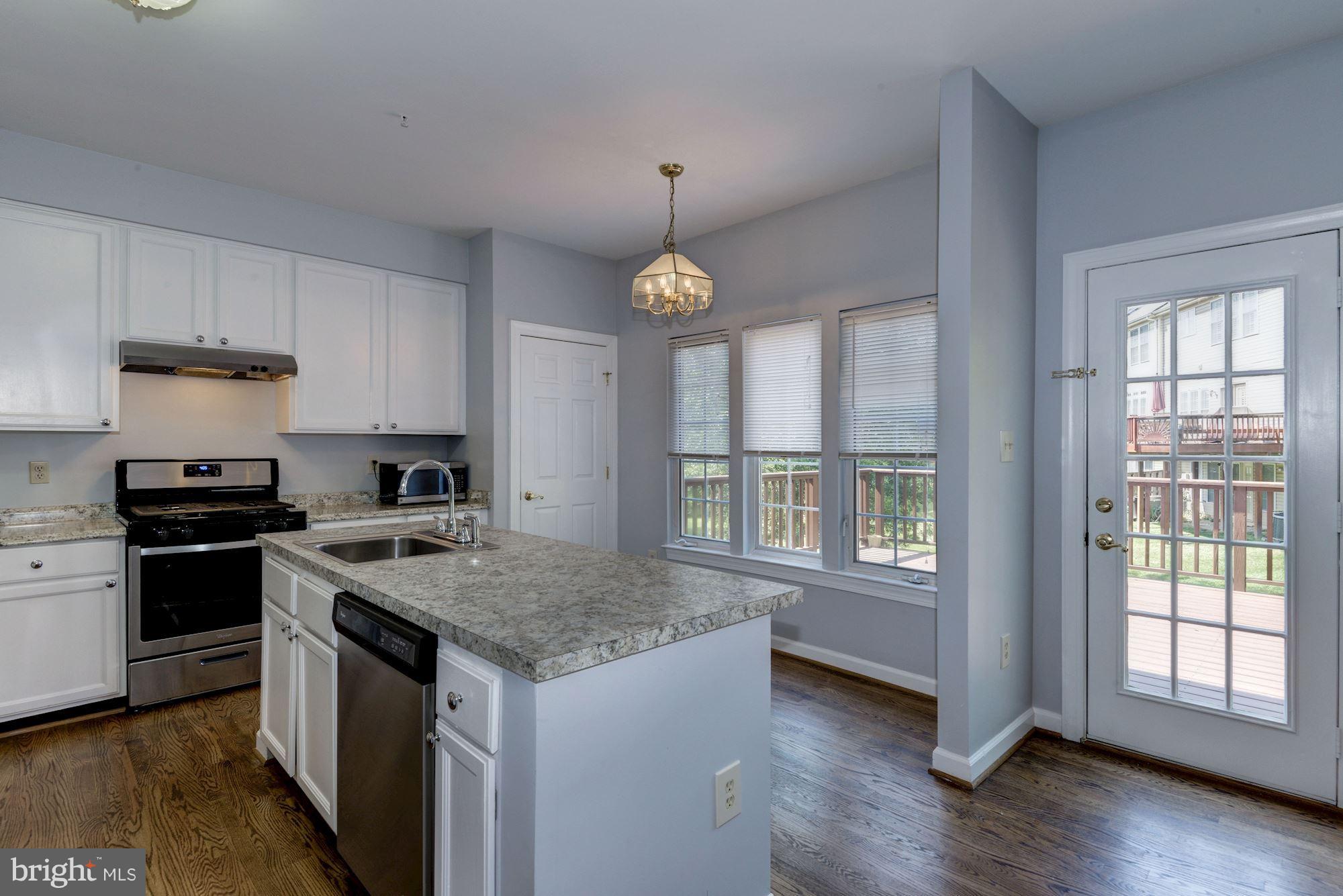 2101 Hounds Run Place Silver Spring, MD 20906 - Photo 11 of 30 a kitchen with a stove and a sink