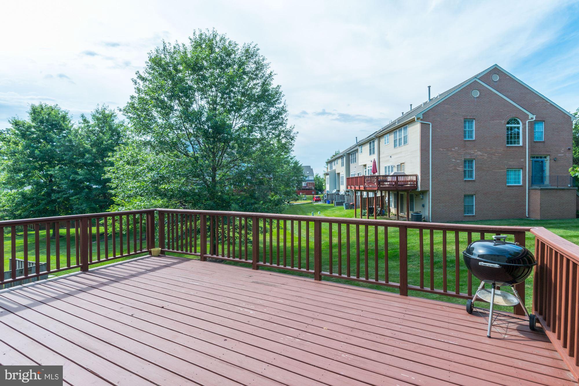 2101 Hounds Run Place Silver Spring, MD 20906 - Photo 13 of 30 a balcony with wooden floor and fence