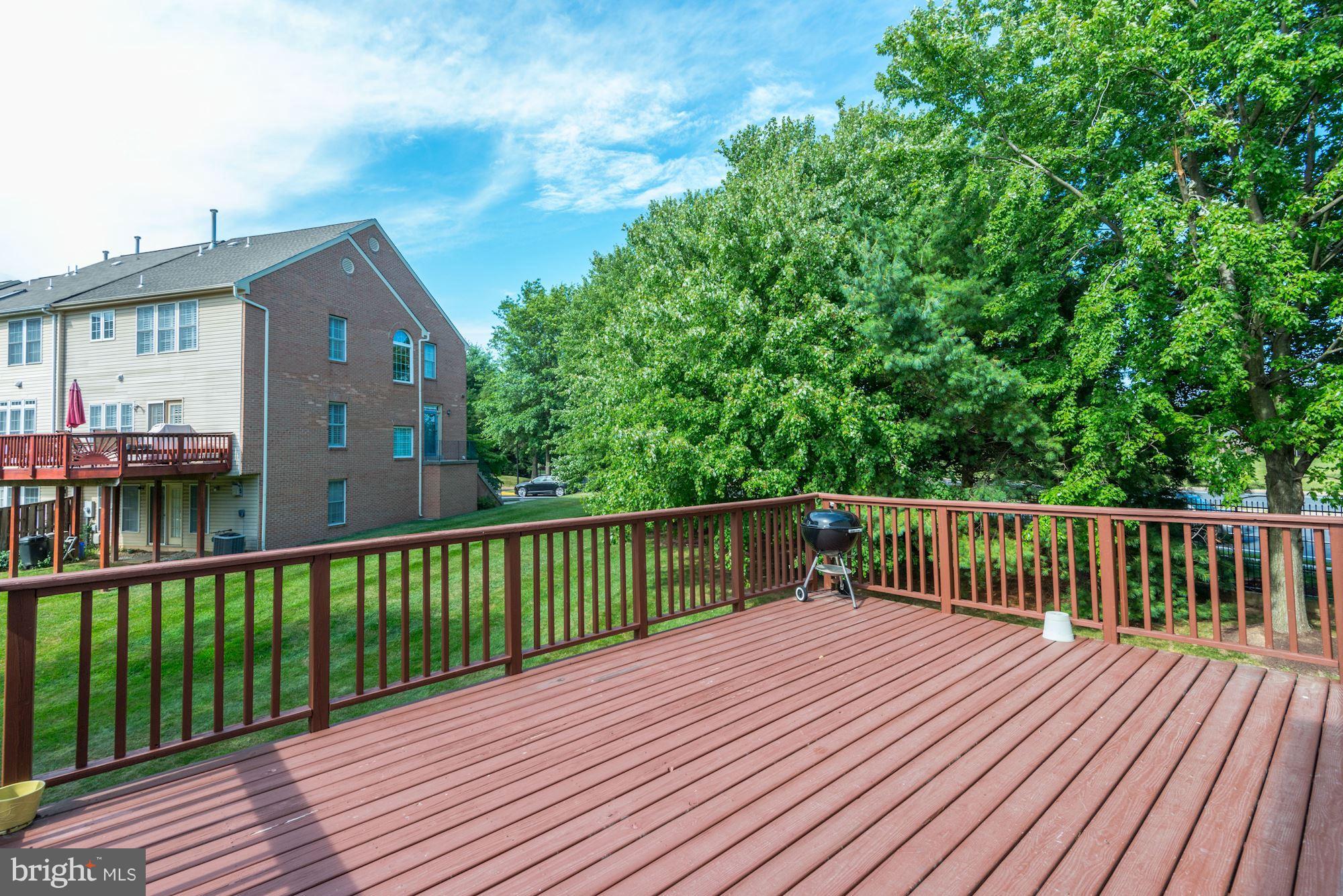 2101 Hounds Run Place Silver Spring, MD 20906 - Photo 14 of 30 a view of a wooden deck and a yard
