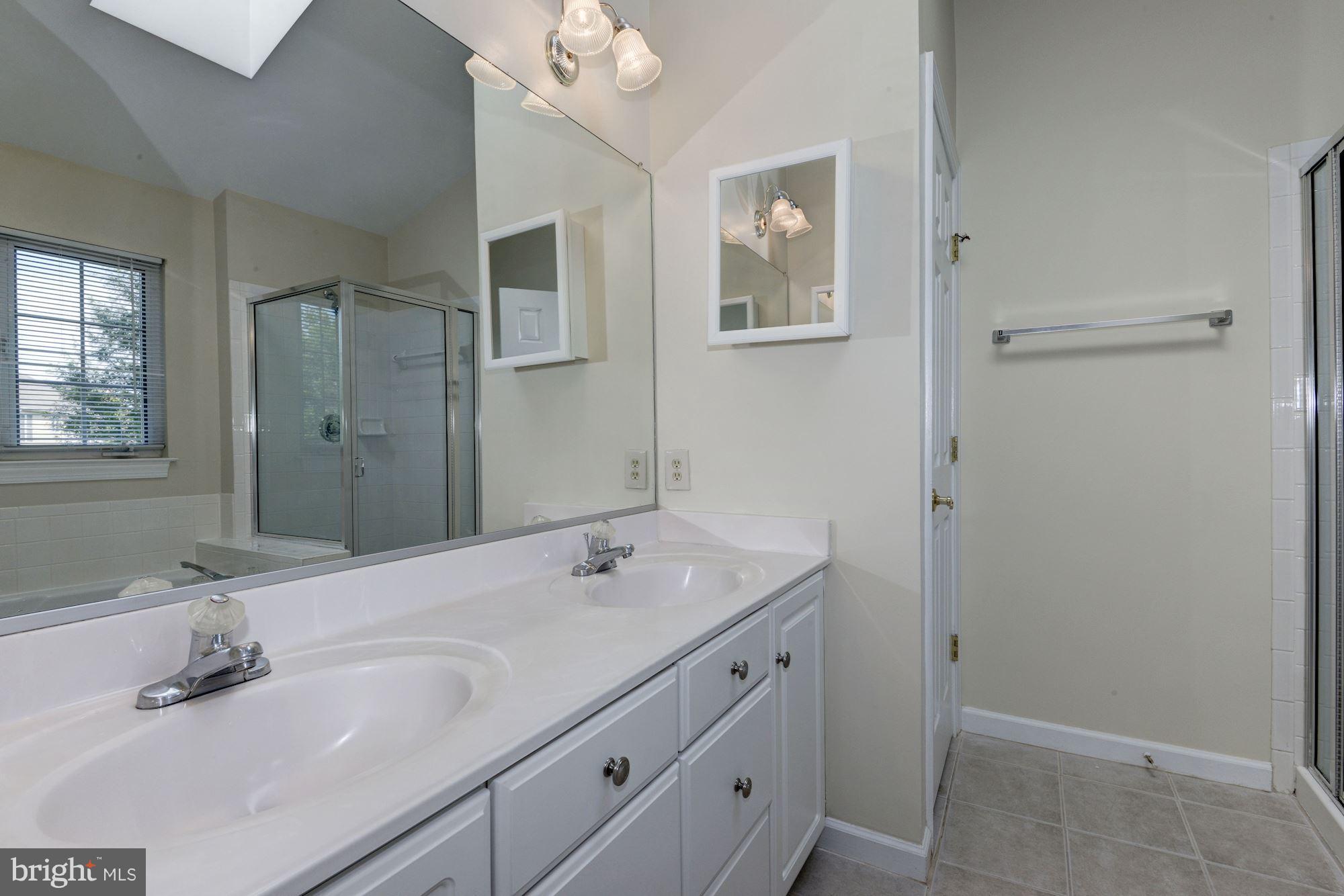 2101 Hounds Run Place Silver Spring, MD 20906 - Photo 19 of 30 a bathroom with a sink and a mirror