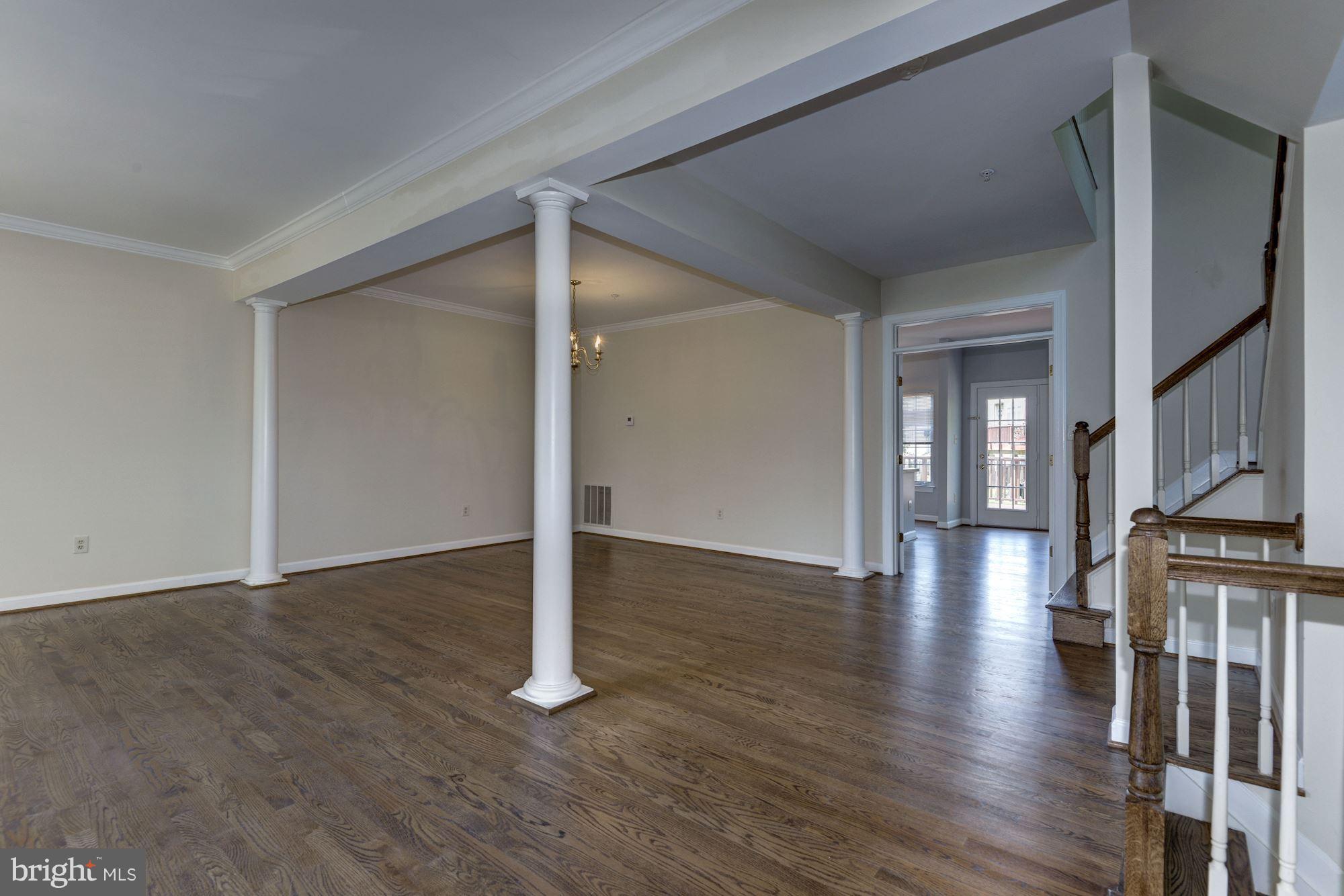 2101 Hounds Run Place Silver Spring, MD 20906 - Photo 4 of 30 a view of a hallway with wooden floor and staircase