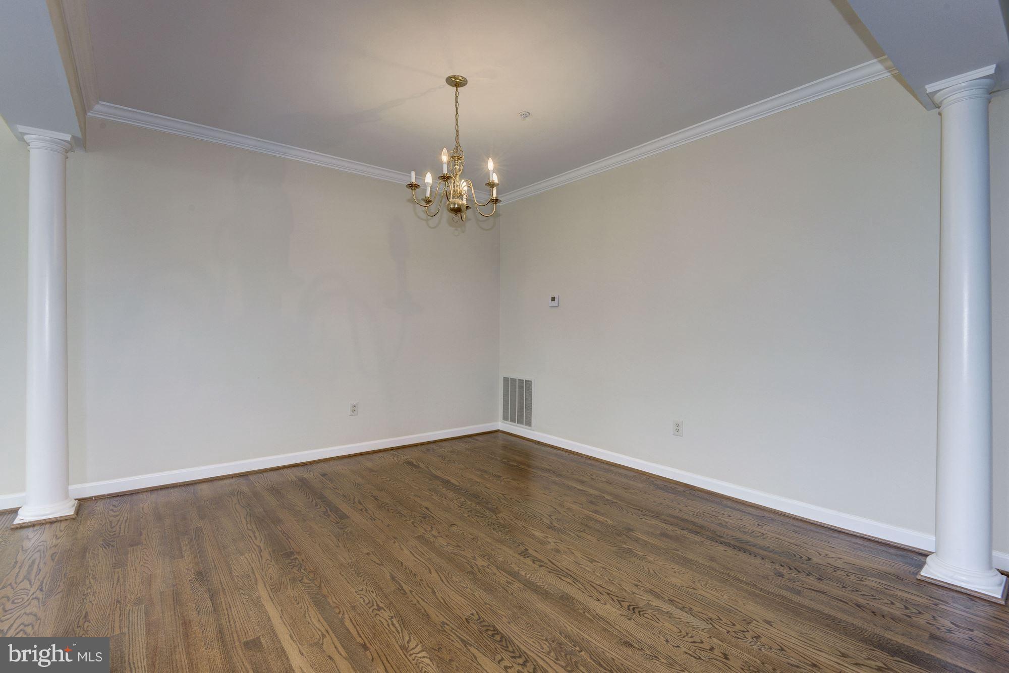2101 Hounds Run Place Silver Spring, MD 20906 - Photo 6 of 30 a view of empty room with wooden floor