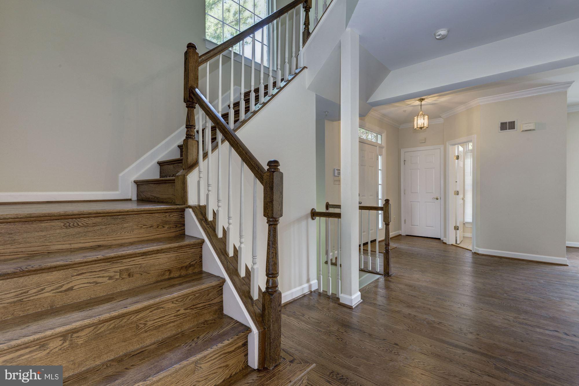 2101 Hounds Run Place Silver Spring, MD 20906 - Photo 7 of 30 a view of staircase with wooden floor and white walls