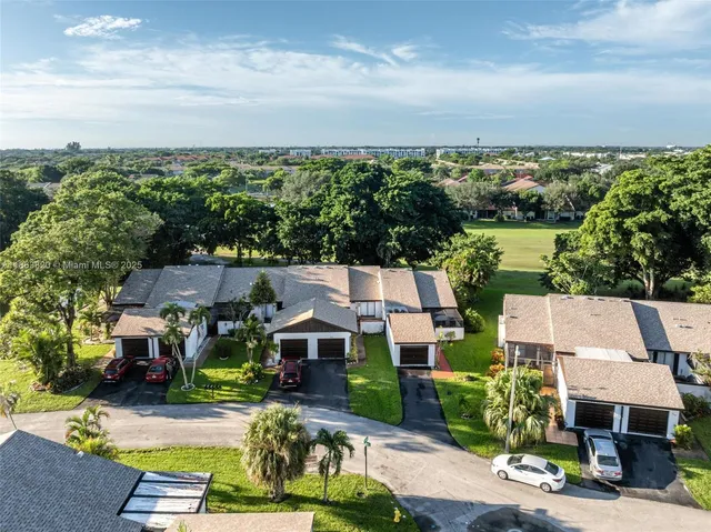 an aerial view of a house with a lake view