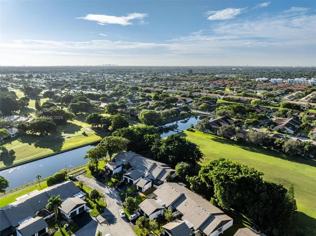 an aerial view of residential building with trees