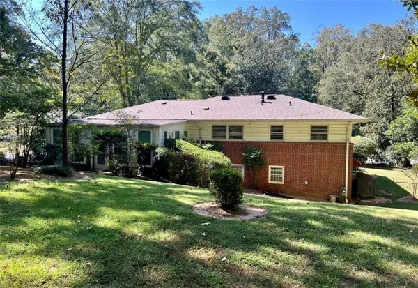 a backyard of a house with lots of green space