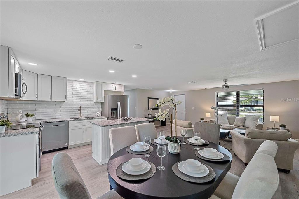 105 Clemson Road Venice, FL 34293 - Photo 7 of 15 a kitchen with a dining table and chairs
