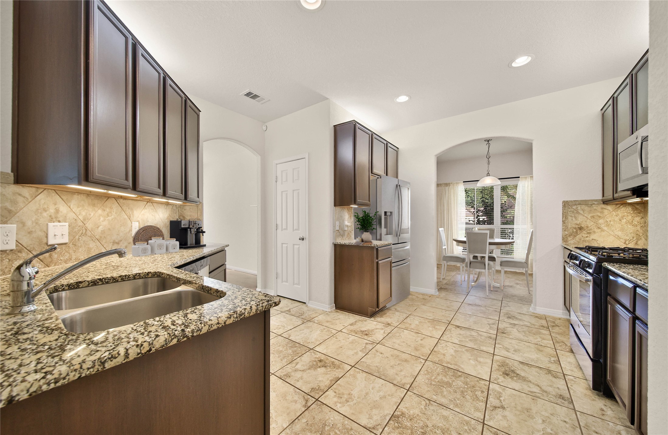 2672 Magnolia Fair Way Spring, TX 77386 - Photo 7 of 49 Your family chef is sure to appreciate the gourmet kitchen! Granite counters, under cabinet lighting, and abundant storage are features to love.
