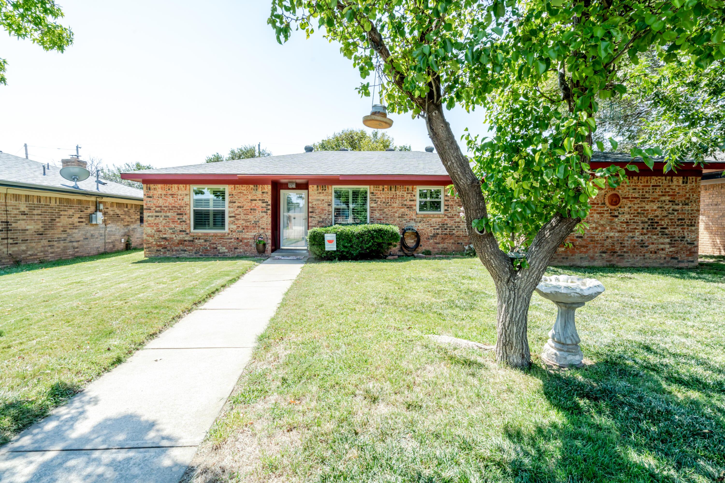 3908 Lewis Drive Amarillo, TX 79109 - Photo 1 of 36 front view of a house with a yard