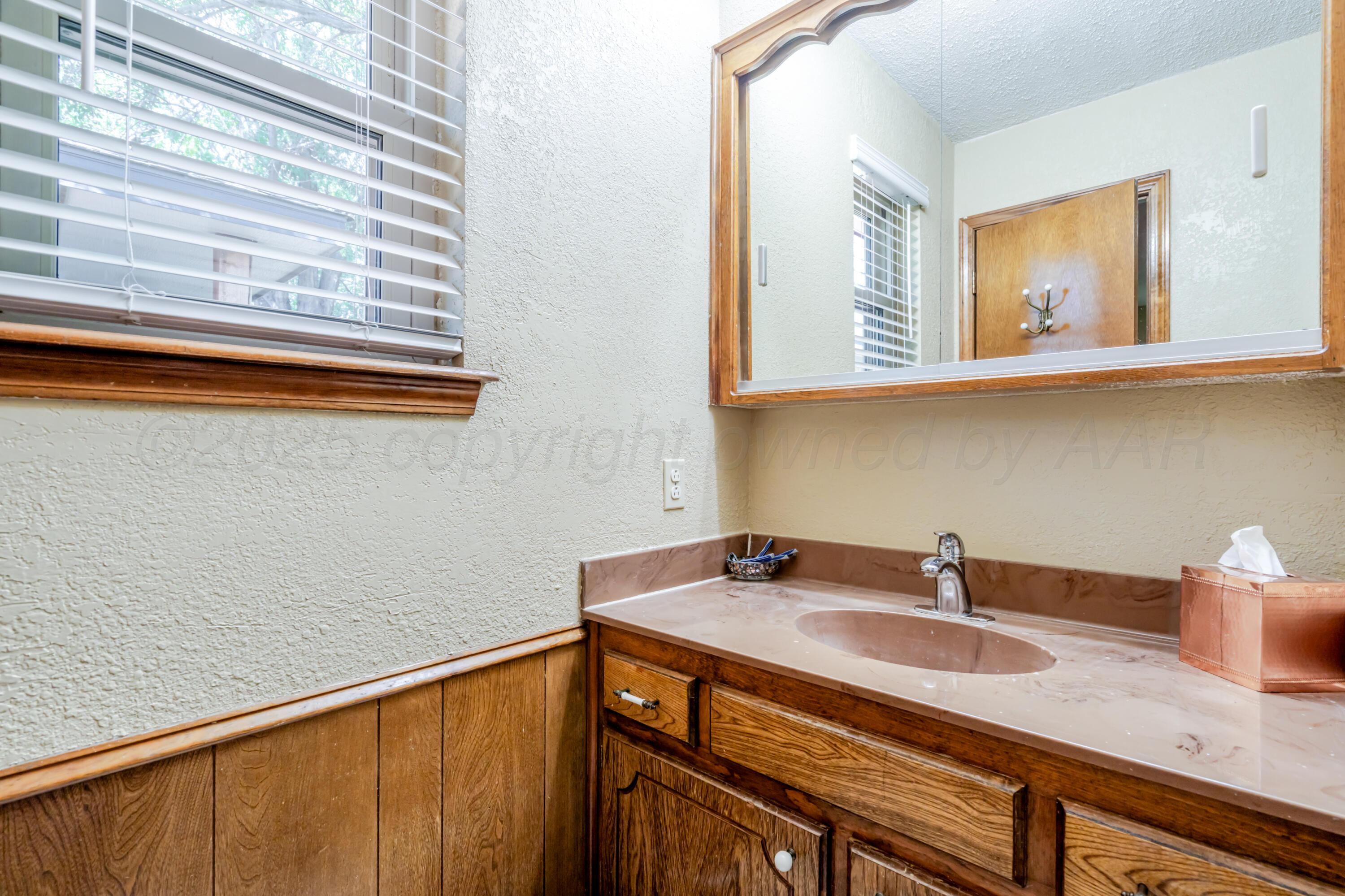 3908 Lewis Drive Amarillo, TX 79109 - Photo 19 of 36 a view of a sink and a window