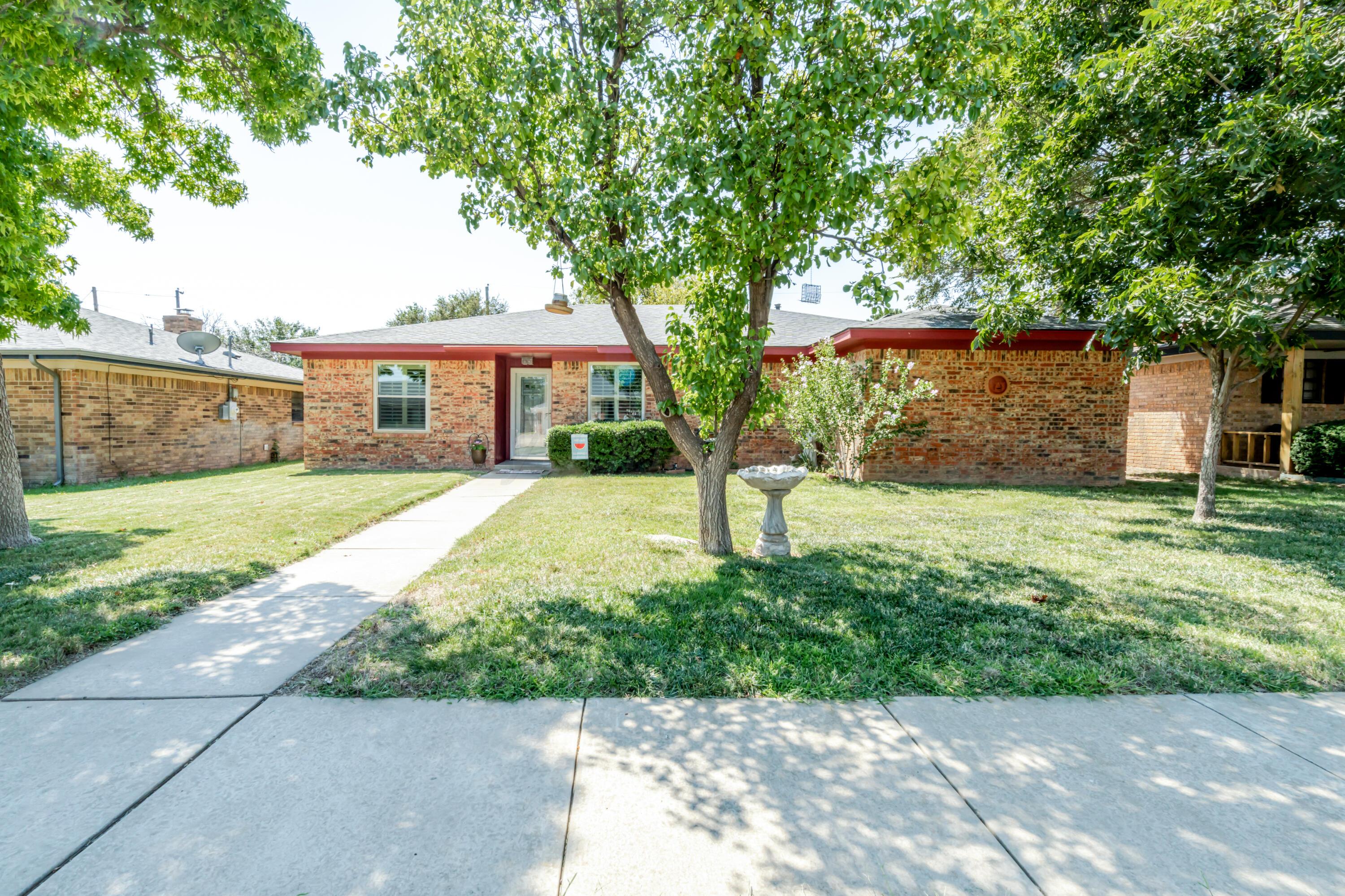 3908 Lewis Drive Amarillo, TX 79109 - Photo 2 of 36 a front view of house with yard and green space