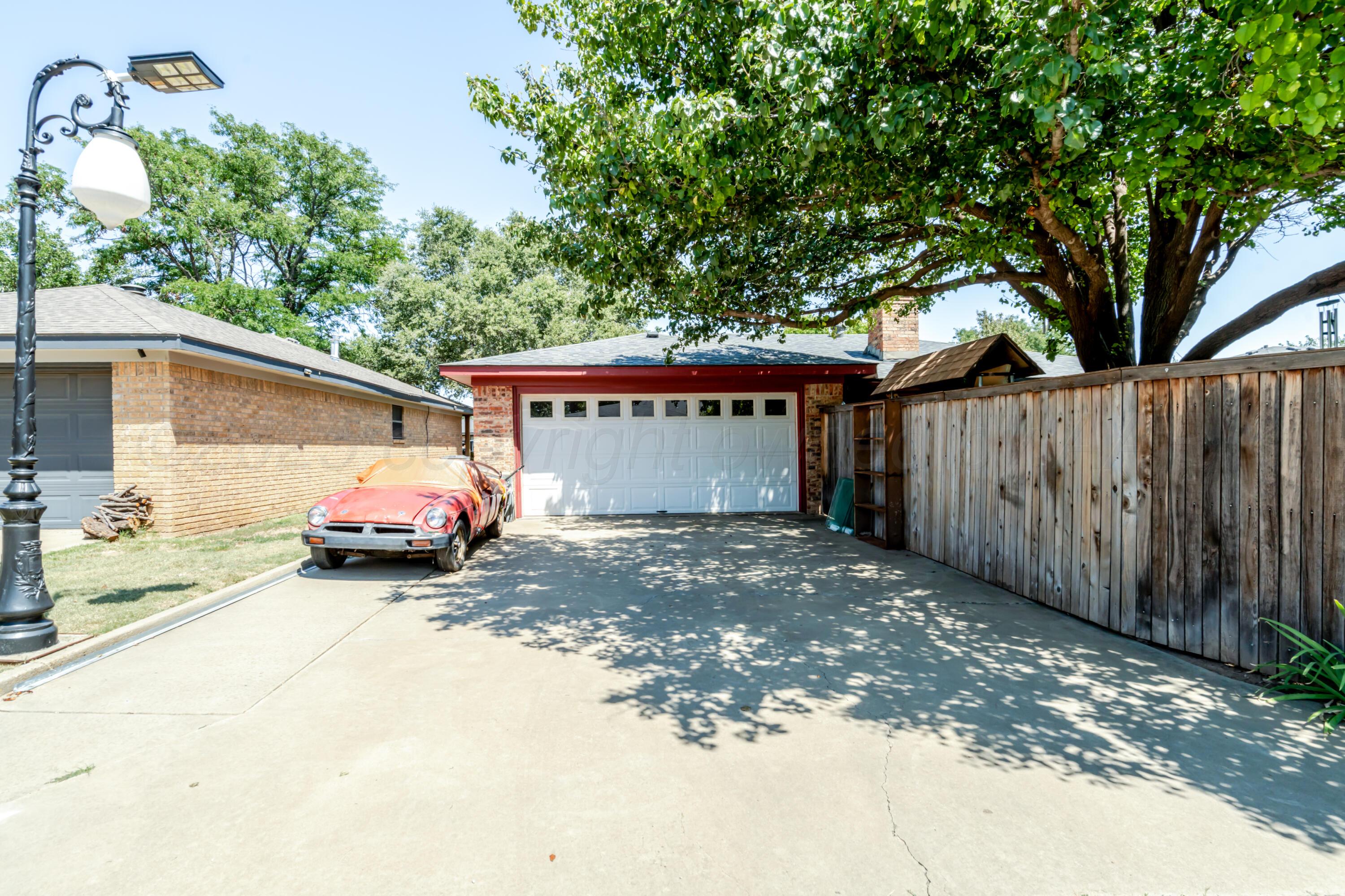 3908 Lewis Drive Amarillo, TX 79109 - Photo 36 of 36 a view of a house with a yard and garage