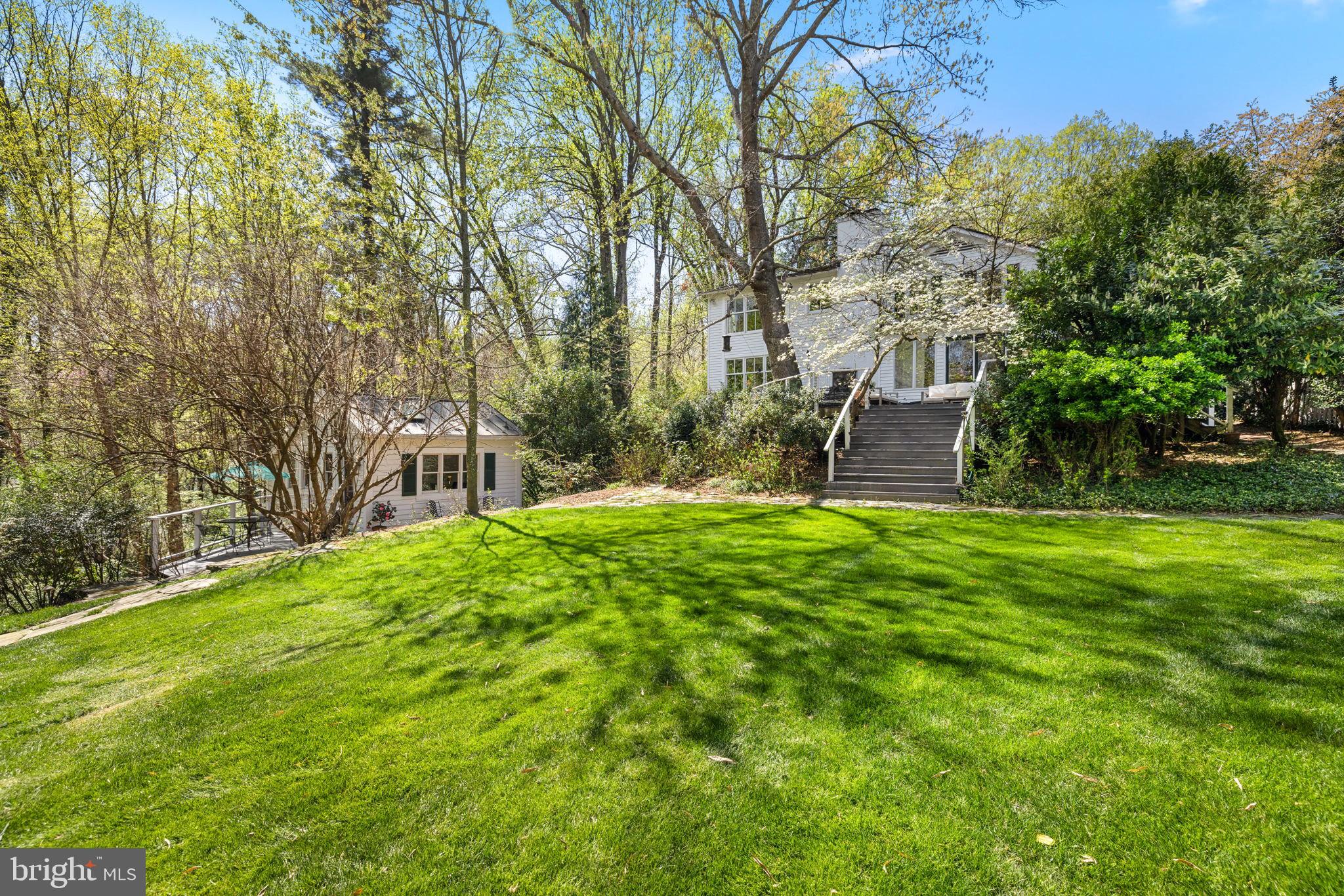 6139 Franklin Park Road McLean, VA 22101 - Photo 1 of 49 a backyard of a house with table and chairs